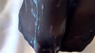 Dark Hair Slut in Black Pantyhose Gives POV Footjob Ends with Cum on Her Feet