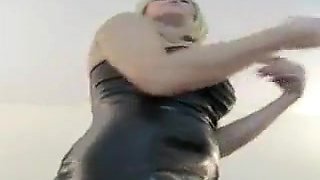 Blonde girl in tight leather dress