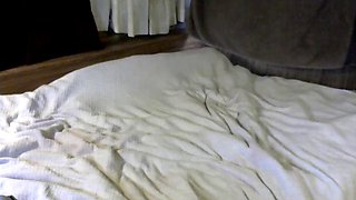 Horny shemale amateur enjoys masturbation and playing on a bed