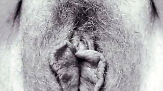 Chubby milf masturbates. Close-up of hairy cunt, clitoris
