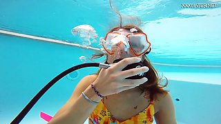 Adorable light-haired Katya Nakolkina shows off her swimsuit underwater
