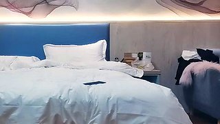 Cute amateur asian web cam girl playing with her toy