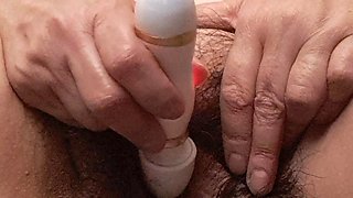 Masturbating with Vibrator on Mature Clitoris