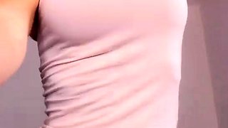 Busty babe playing with her big boobs