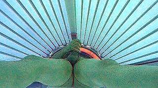 Masturbating in public tanning bed