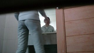 Peeing spy cam shot of a cute asian girl on a toilet