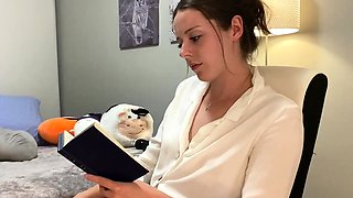 Voyeur of sexy brunette reading a hot romance novel and