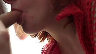 Mature redhead gives a good blow job in the bathroom