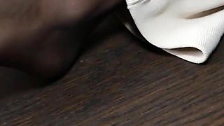 Shy Secretary Kerry Displays Her Nylon Feet on the Table