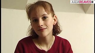 Skinny redhead strips on bed and fingers herself with moaning tits