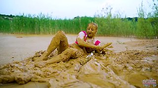 German teen masturbates to orgasm in muddy lake - wet and messy solo fingering