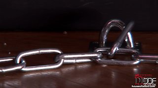 Bound latex-wearing Bailey peeing