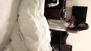 Cute amateur asian web cam girl playing with her toy