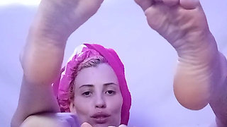 Skinny Girl Applying Oil to Her Body