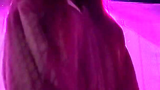 Smoking a Cigarette Outdoor While Wearing Only a Bikini and a Jacket