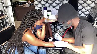 Busty African girl gets her nipples pierced