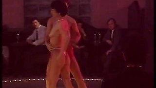 Blonde stripper bends showing shaved pussy