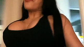 A super sexy brunette massages her big boobs