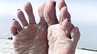 Milf seductress showing off her fabulous feet outdoors