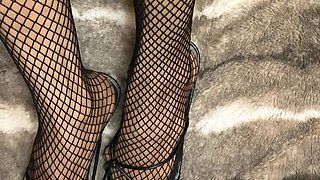 Fishnet in Open Toe Shoes with Red Nail Polish