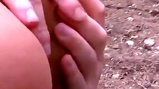 Two sluts tie up a man in a forest and punished his cock by getting fucked