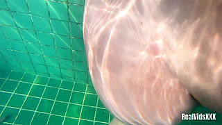 A Young Hottie Fucks with Her Boyfriend in the Pool Under Water