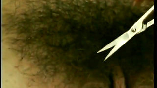 Sexy young babe trims her pubic hair and has sensual shower